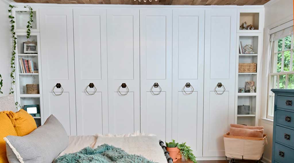 customized ikea built-in storage cabinets in a bedroom 
